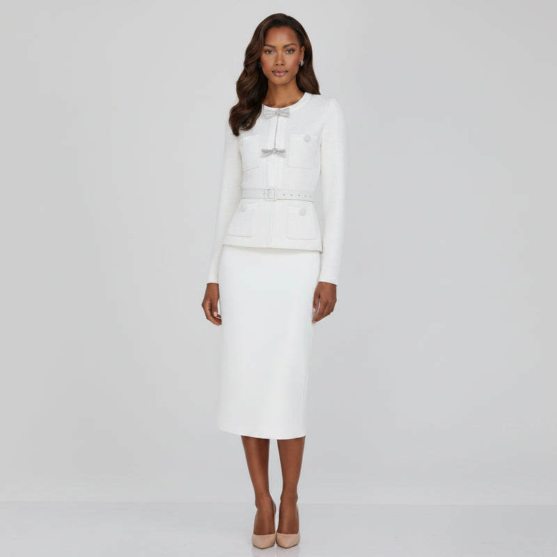 Woman wearing a white outfit with a belt on a white background
