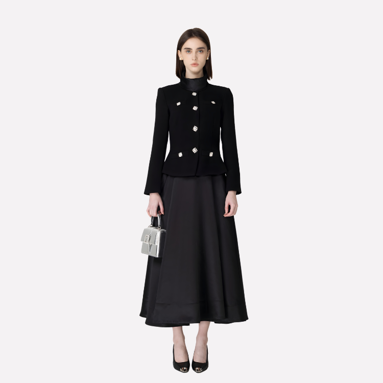 Woman wearing a black outfit with a white background