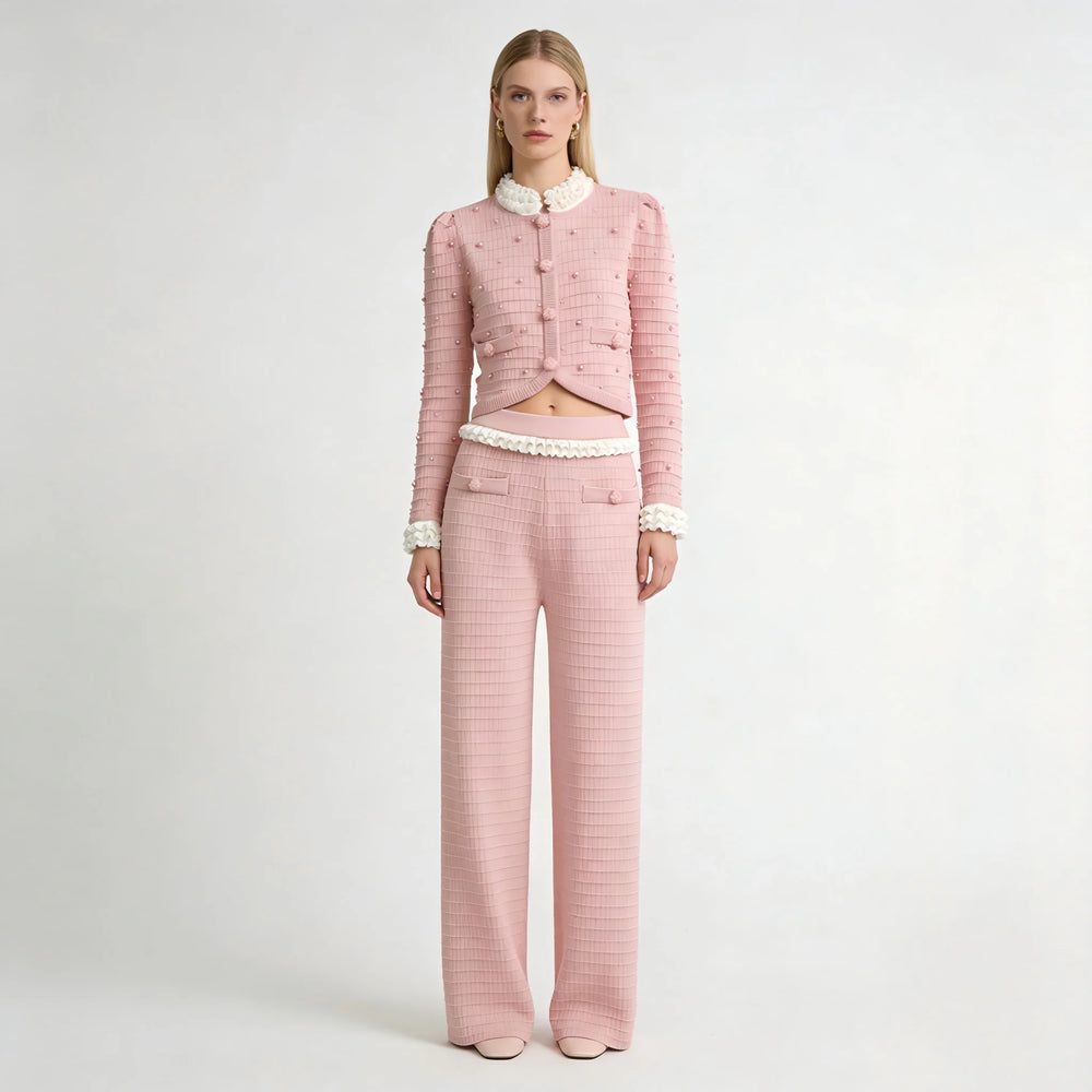 Pink checkered outfit with white lace details on a white background
