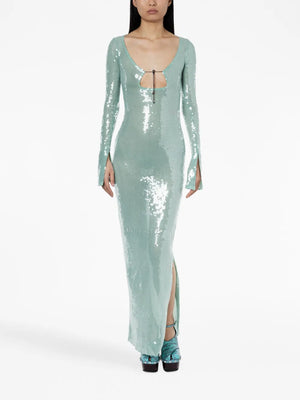 Mint green sequin dress with long sleeves and a slit on a white background