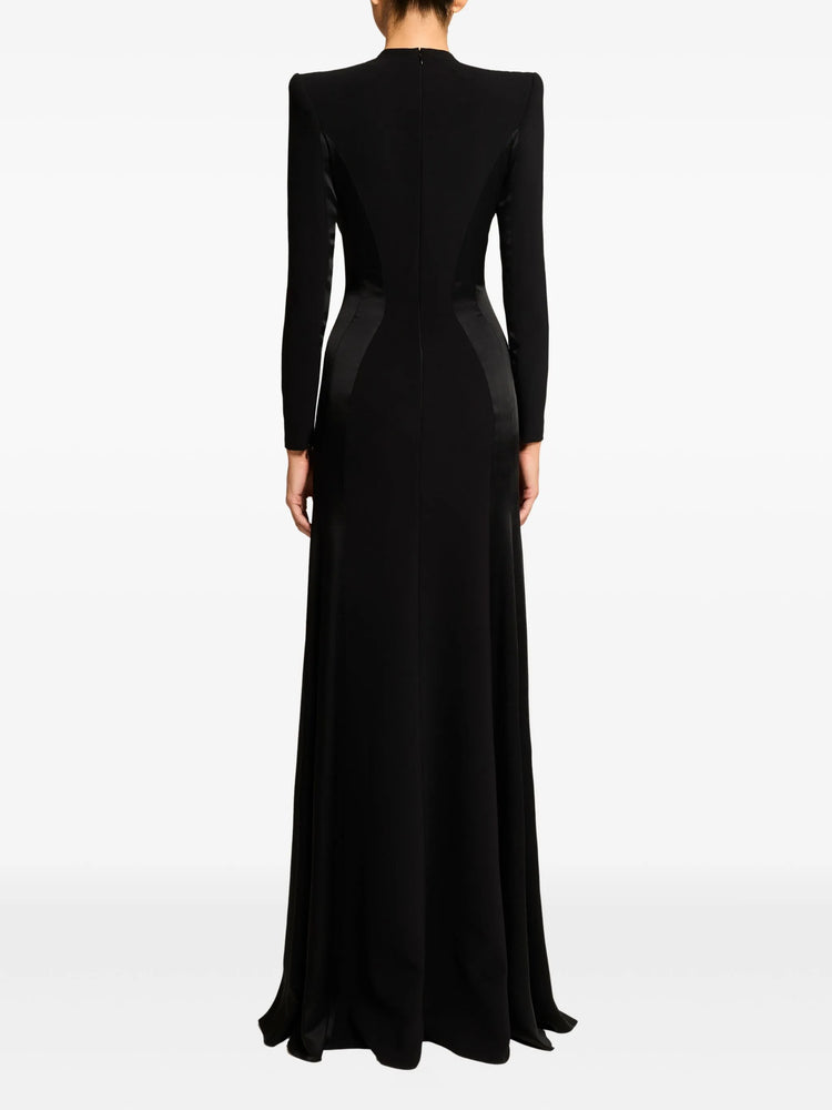 Black evening gown with silver embellishments on a white background