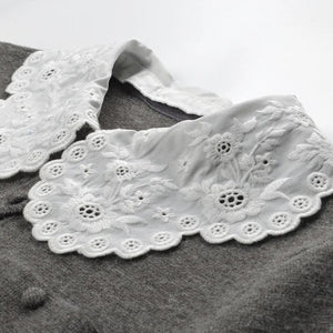 White lace collar on a gray garment