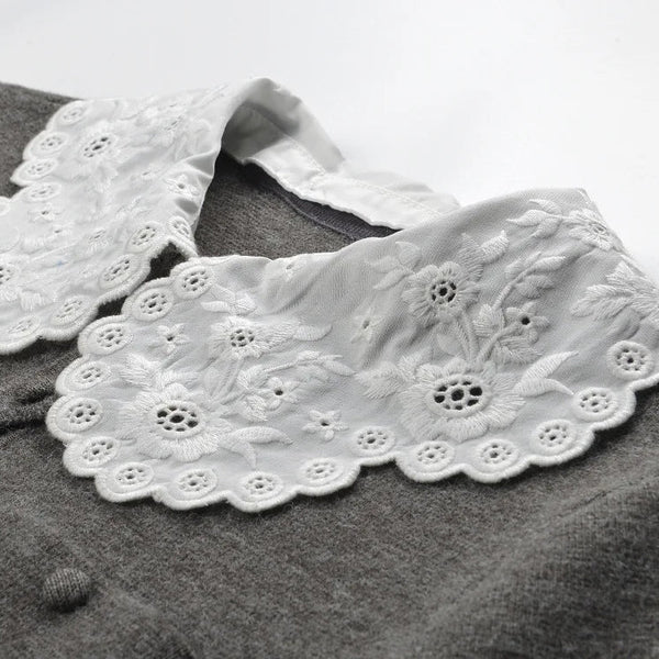White lace collar on a gray garment