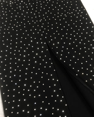 Close-up of black fabric with white polka dot pattern