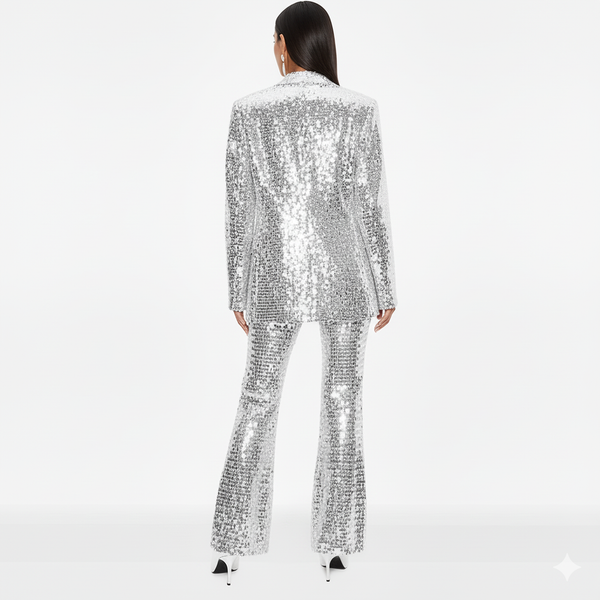 Person wearing a silver sequin suit on a white background