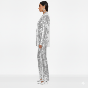 Person wearing a silver sequin outfit on a white background