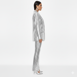 Person wearing a silver sequin suit on a white background