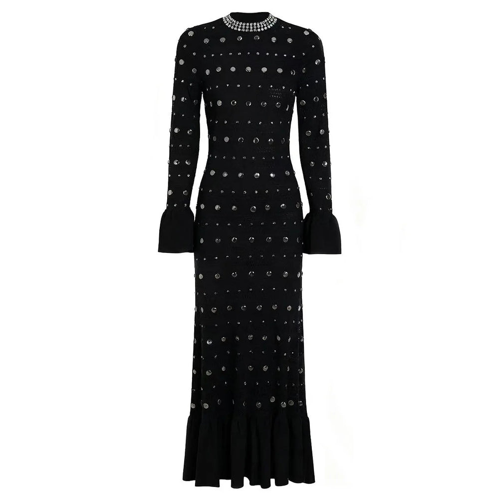 Black dress with silver embellishments on a white background