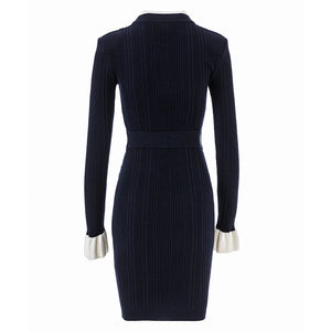 Navy ribbed dress with long sleeves on a white background
