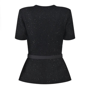 Black textured dress with a belt on a white background