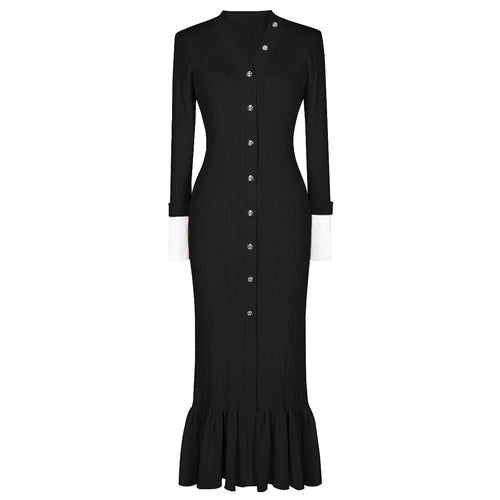 Black dress with buttons and a ruffled hem on a white background