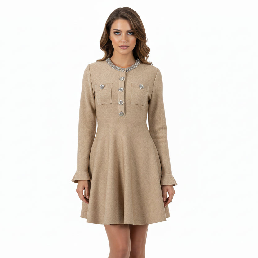 Beige dress with decorative buttons on a white background