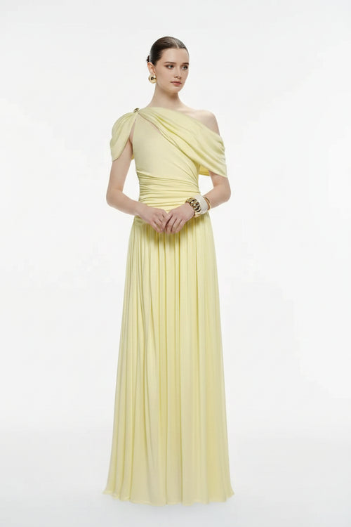 Woman wearing a light yellow one-shoulder dress on a white background