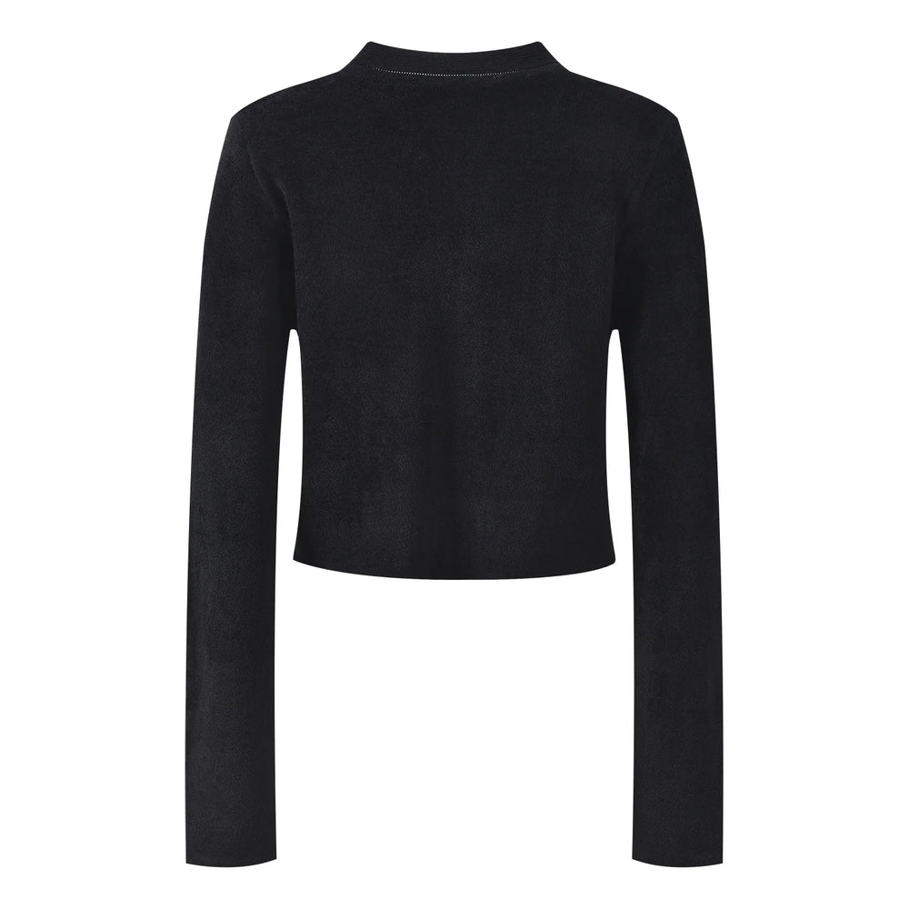Black jacket with decorative buttons and embellishments on a white background