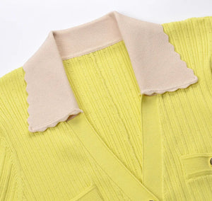 Yellow sweater with beige collar on a white background