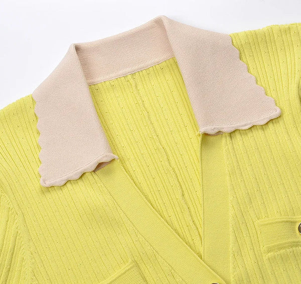 Yellow sweater with beige collar on a white background