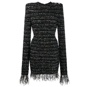 Black and white patterned dress with fringes on a white background