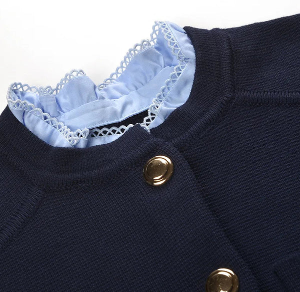 Navy blue jacket with gold buttons and light blue ruffled collar on a white background