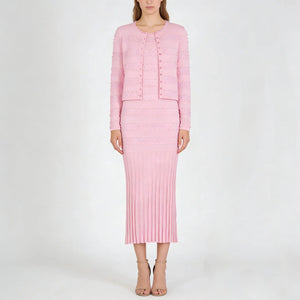 Woman wearing a pink outfit on a white background