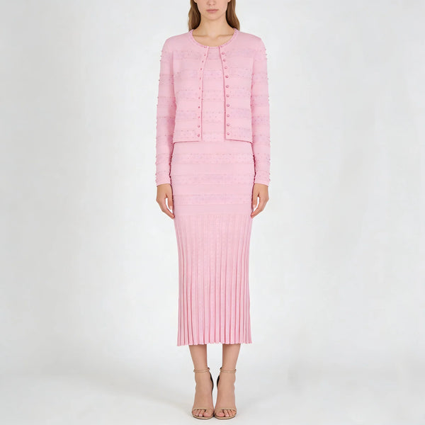 Woman wearing a pink outfit on a white background