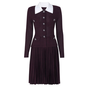 Dark purple dress with white collar and decorative buttons on a white background