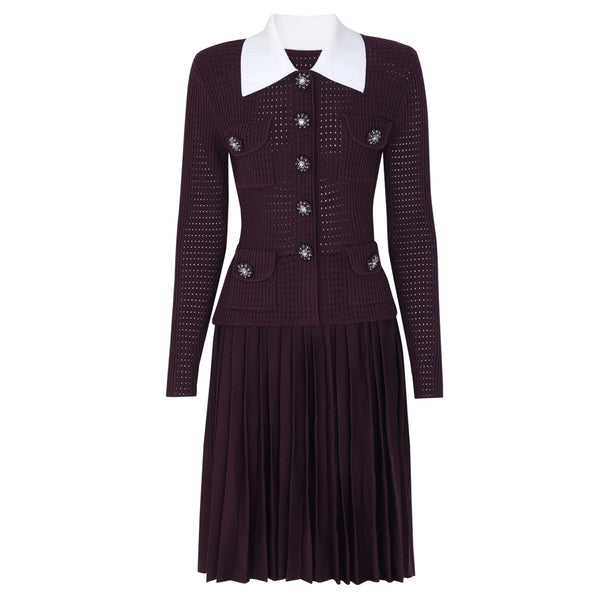 Dark purple dress with white collar and decorative buttons on a white background