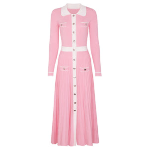 Pink dress with white collar and buttons on a white background