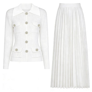 White blazer with button details and a white pleated skirt on a white background