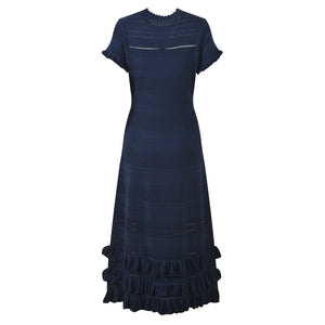 Navy blue dress with ruffled hem on a white background