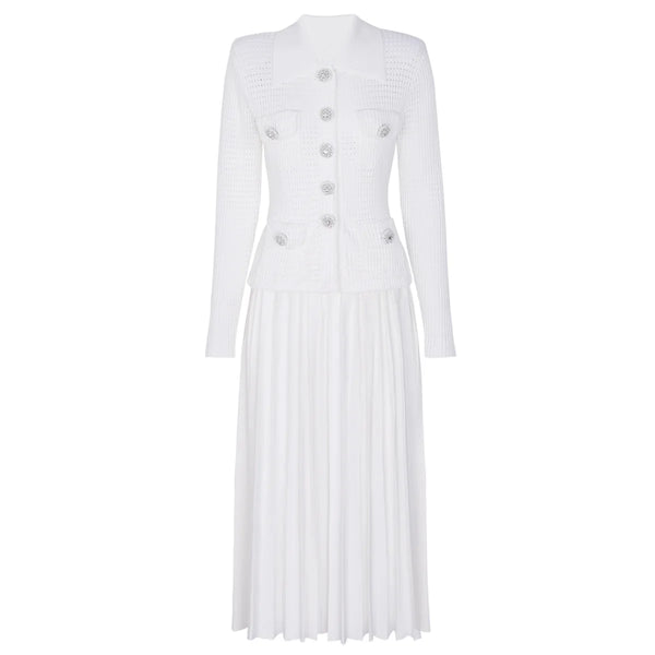 White pleated dress with button details on a white background