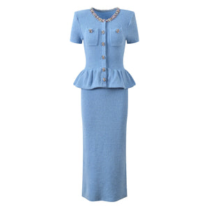 Light blue dress with peplum top and skirt on a white background