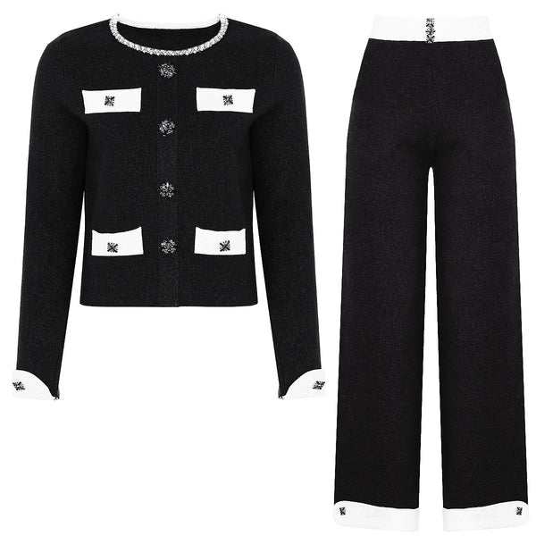 Black outfit with white accents on a white background