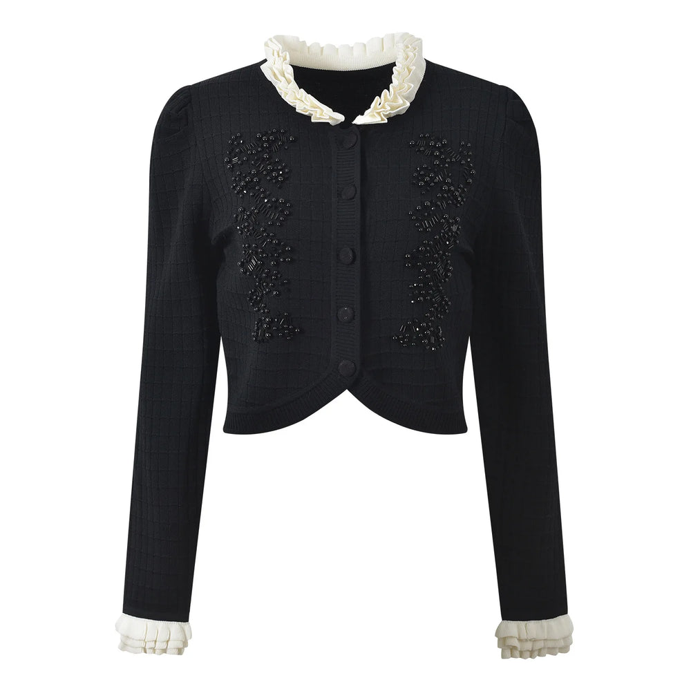 Black jacket with white lace trim on a white background