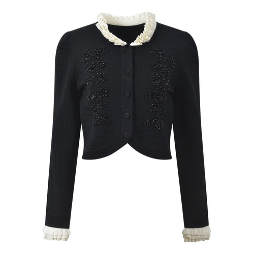 Black jacket with white lace trim on a white background
