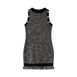 Black and white patterned dress with button details on a white background