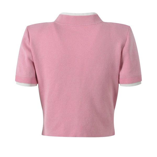 Pink short-sleeve cardigan on a white background
