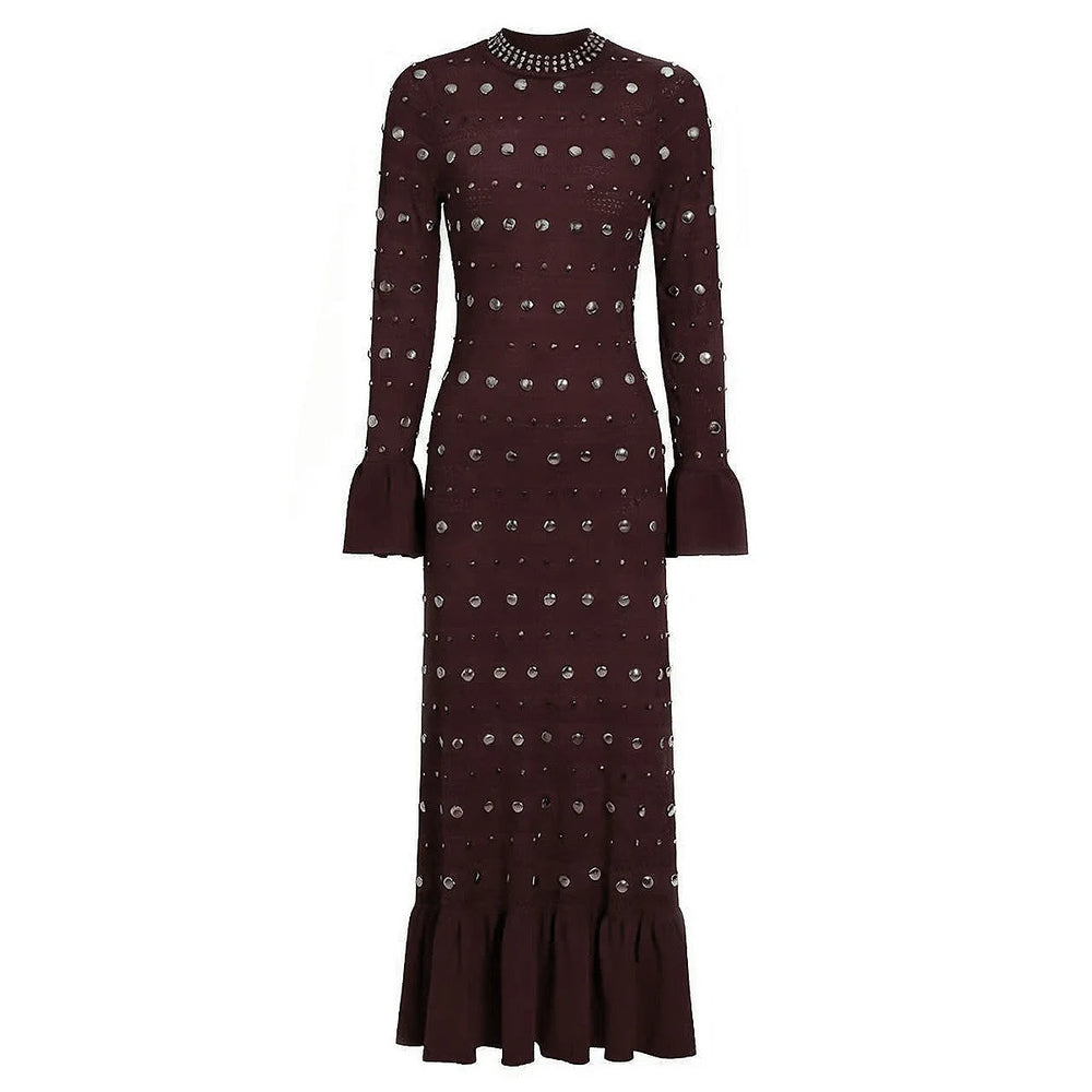 Black dress with silver embellishments on a white background