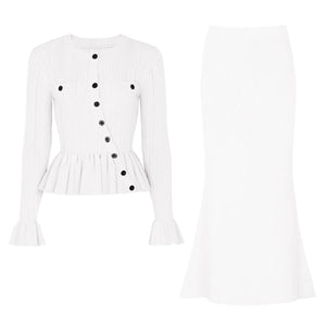 White blouse with black buttons on a white background
