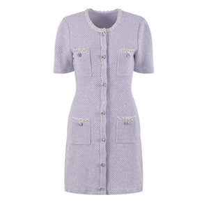 Short-sleeve dress with button details on a white background