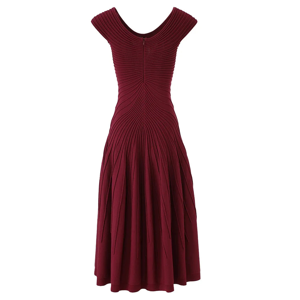 Maroon dress with pleated bodice on a white background
