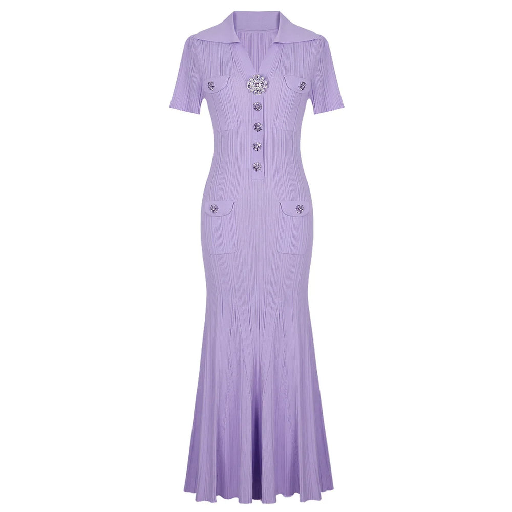 Purple dress with decorative buttons on a white background