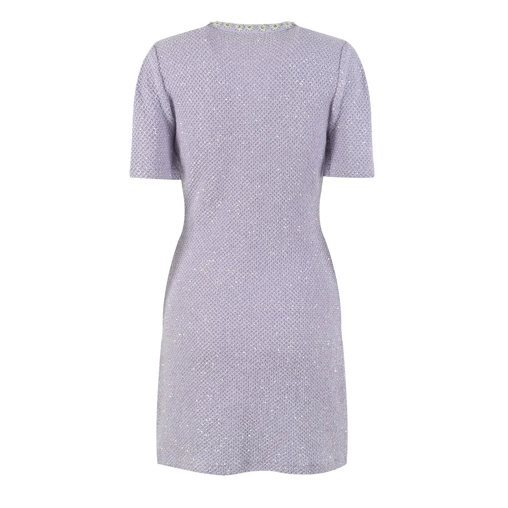 Short-sleeve dress with button details on a white background