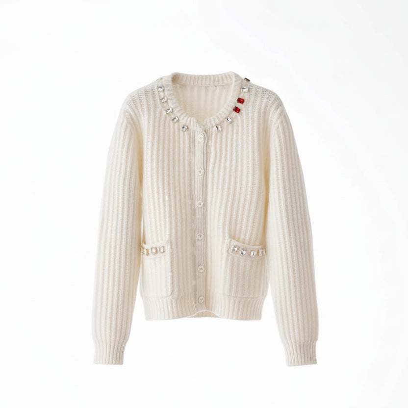 White ribbed sweater with decorative buttons on a wooden hanger against a white background