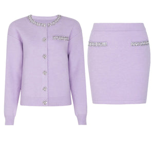 Lavender cardigan and skirt set with decorative elements on a white background