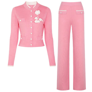 Pink outfit with a jacket and pants on a white background