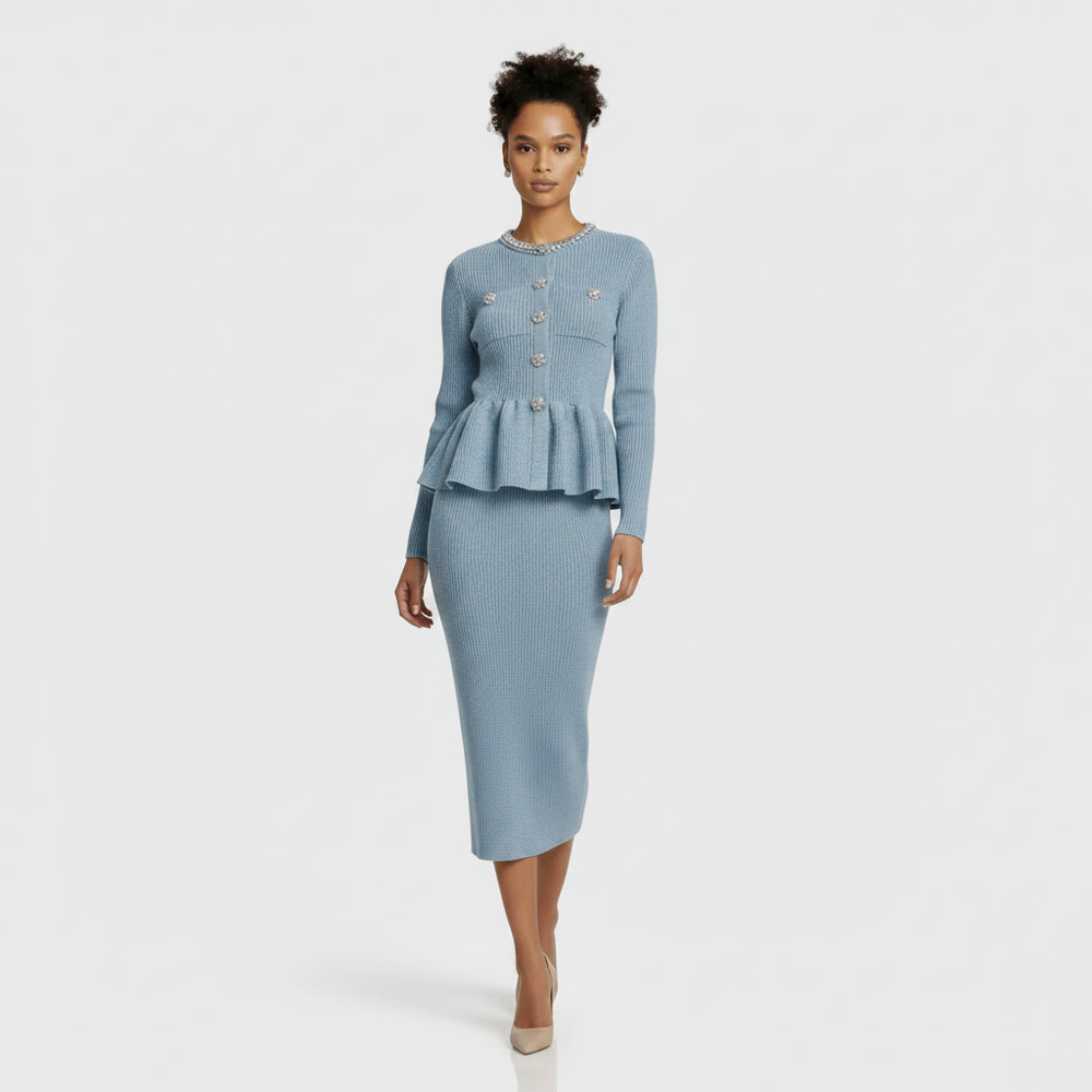 Light blue ribbed sweater with decorative buttons and matching skirt on a white background