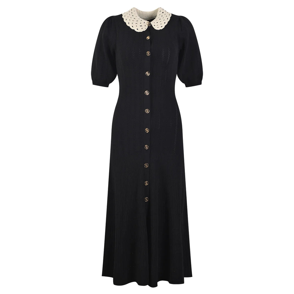 Black dress with a white collar on a white background