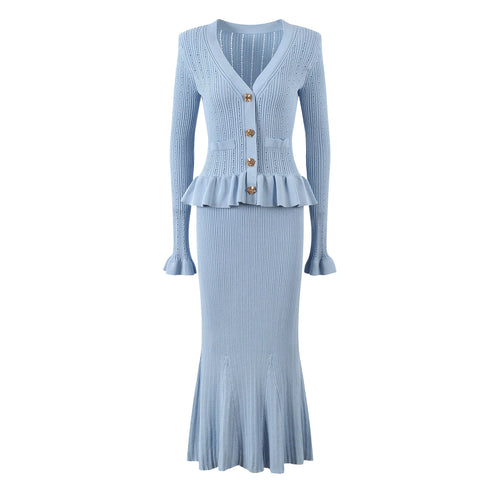 Light blue ribbed knit dress with peplum waist on a white background