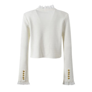 White ribbed sweater with gold buttons on a white background