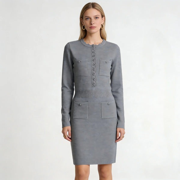 Woman wearing a gray dress with button details on a white background